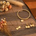Gold jewelry western flat lay - no cowboy hat